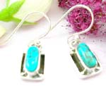 Sterling silver earring with clip-in fish hook for and oval blue turquoise stone embedded
